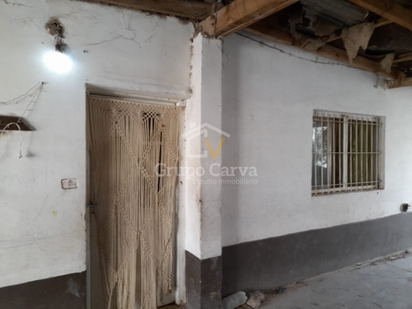 Casa con local comercial